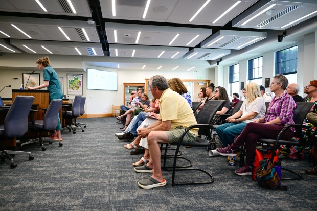 Erie resident Emily Brecht, left, speaks during public comment at a special town council meeting in Erie on Tuesday, June 16, 2026. (Matthew Jonas/Daily Camera)