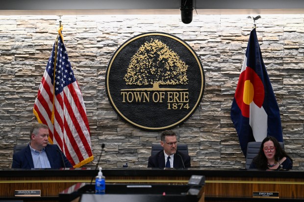 From left, Mayor Pro Tem Brandon Bell and Mayor Andrew J. Moore listen as council member Emily Baer speaks during a special town council meeting in Erie on Tuesday, June 16, 2026. (Matthew Jonas/Daily Camera)