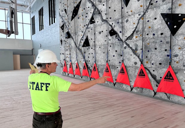 Upper Darby School District Director of Capital Projects Craig Harnitchek talks about the gymnasium and its rock-climbing wall, (PETE BANNAN-DAILY TIMES)