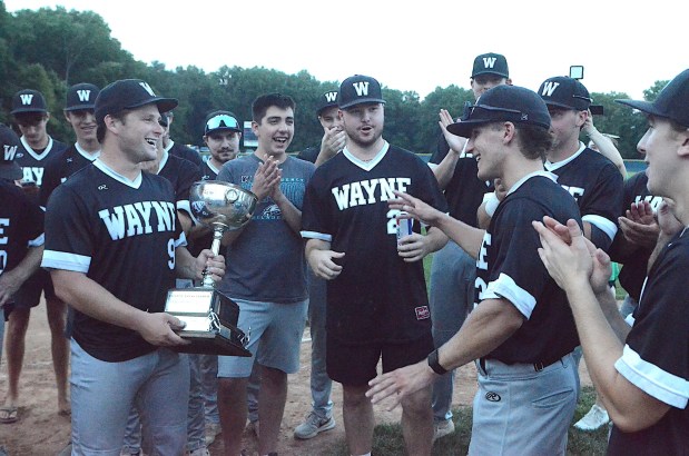 Wayne's Chris Schaller, right, was announced as MVP of the championship series. Schaller had three hits, including a three-run homer, and six RBIs Thursday's title clincher. (PETE BANNAN/MediaNews Group)