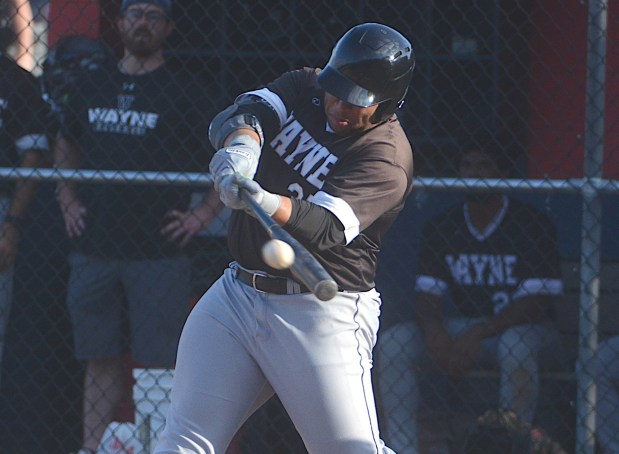 Steven Wells belts a home run during Wayne's 21-2 victory over Upper Darby Thursday night to clinch the Delco League championship. (PETE BANNAN/MediaNews Group)