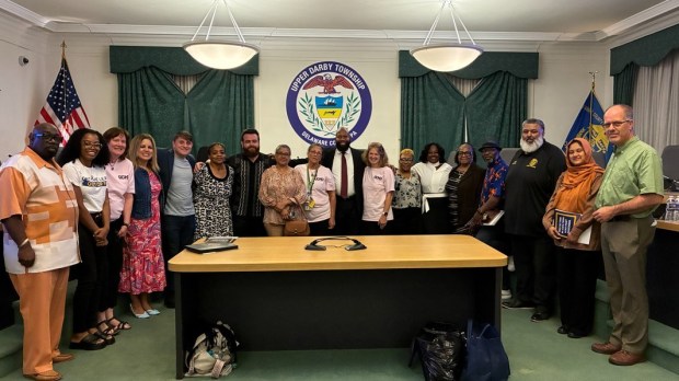 Celebrating approval of the lead poisoning ordinance on Wednesday night at the Upper Darby Township Council meeting are, from left: Myron McNeely, 5th district council member; Asha Criner; Rosemarie Halt; Melissa DiNofia-Bozzone, 3rd district council member; Kyle McIntyre, at-large, council member; Michelle Billups, council president; Noah Fields, council vice president; Rajinder Kaur; Mary Nixon; Mayor Ed Brown; Lora Seigmann Werner; Donna Smith; Danyelle Blackwell, 4th district council member; Portia Kamara; David Bantoe, 6th district council member; Amrinder Singh; Syama Disa, 7th district council member; and Brian O'Neill, 1st district council member. (COURTESY PHOTO)
