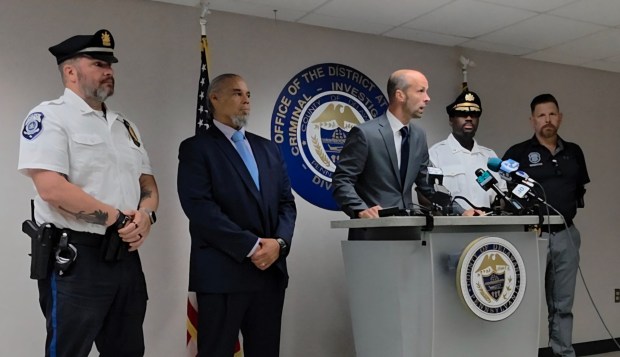 District Attorney Tanner Rouse, center, describes the shooting and how investigators quickly identified the suspect. "It was pretty quickly apparent who we were looking for," the DA said Monday at a news conference. With Rouse are, from left, Darby Township Lt. Craig White, Chief of Delaware County detectives Erick Echevarria, Darby Township Deputy Chief Corey Cooper and Darby Township Sgt. Lance Csanady. (ALEX ROSE - DAILY TIMES)