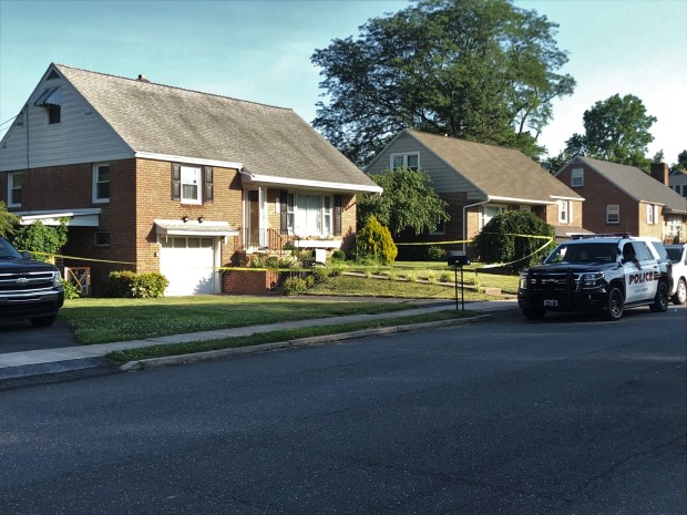 Police protect the scene in the 100 block of West 46th Street in Exeter Township on June 30, 2022, hours after a child was found dead. (STEVEN HENSHAW READING EAGLE)