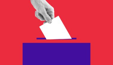 hand putting ballot in box