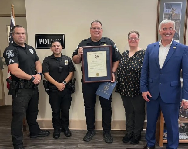 Cpl. Ryan Brobst, Officer Tito Loor, Chief Anthony Kuklinski, Administrative Officer Dana McGarvey and State Rep. Jamie Barton gather as the department is recognized for earning state accreditation. (COURTESY OF HAMBURG POLICE)