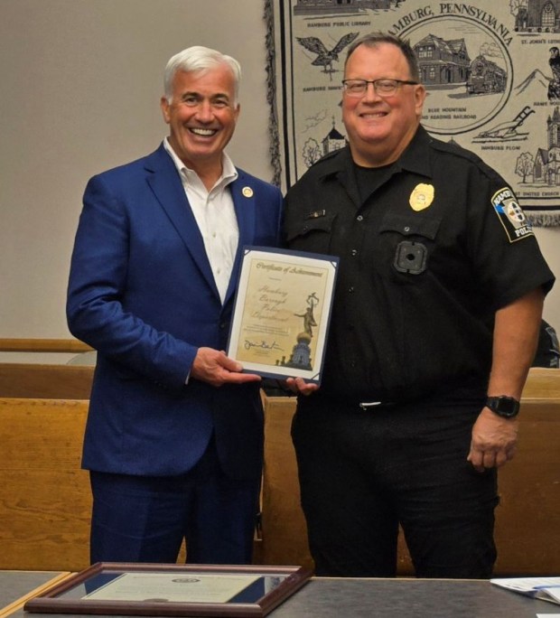 State Rep. Jamie Barton presents a certificate of achievement to Hamburg Police Chief Anthony Kuklinski during a recognition ceremony at the borough municipal building on July 28. (COURTESY OF HAMBURG POLICE)