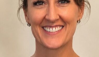 person in black top smiles for camera