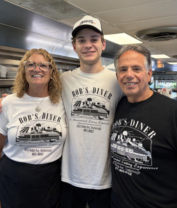 Trisha Harder, grandson Jake and Jim Evans with energy to spare after a busy Saturday morning rush. (Photo courtesy of John Katrina)