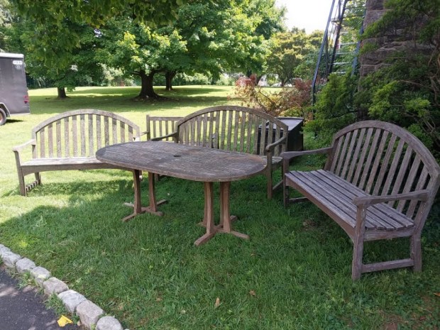 Board Member Meghan McGeoy had a huge hand in securing these donated teak benches and table that will adorn the grounds. (Photo courtesy of Roxborough Home for Women)