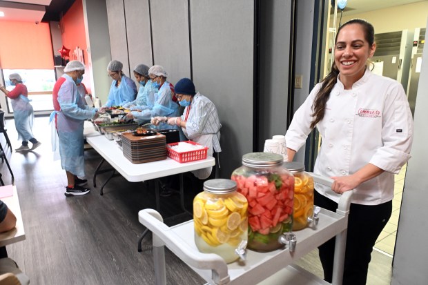 Chef Melanie Galarza, director of culinary operations for Helping Harvest, wheels out flavored waters during the Berks County Area Agency on Aging implementation of an enhanced home-delivered meals program at lunch in the Reading Senior Center, 40 N. Ninth St., on Monday, Aug. 10, 2026. (BILL UHRICH/READING EAGLE)