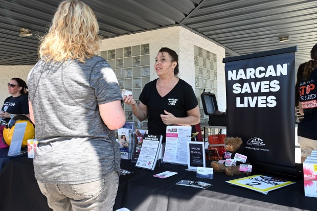 Nicole Charlanza, overdose prevention training coordinator for the Council on Chemical Abuse, explains the use of NARCAN to treat drug overdoses during a motorcycle safety event sponsored by Reading Hospital at Classic Harley Davidson in Bern Township on Saturday, Aug. 29, 2026.  (BILL UHRICH/READING EAGLE)