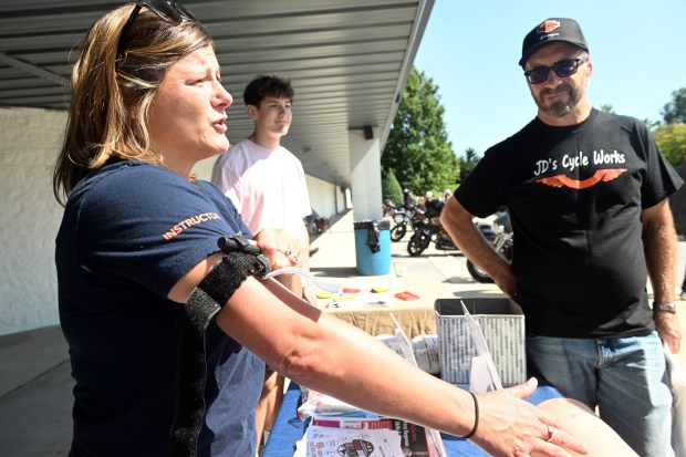 Jennifer Barney, injury prevention outreach coordinator, demonstrates the proper use of a tourniquet during a motorcycle safety event sponsored by Reading Hospital at Classic Harley Davidson in Bern Township on Saturday, Aug. 29, 2026.  (BILL UHRICH/READING EAGLE)