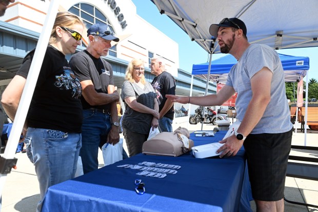 Lenny Brown, EMS outreach liason at Reading Hospital, demonstrates CPR and the use of an AED during a motorcycle safety event sponsored by Reading Hospital at Classic Harley Davidson in Bern Township on Saturday, Aug. 29, 2026.  (BILL UHRICH/READING EAGLE)