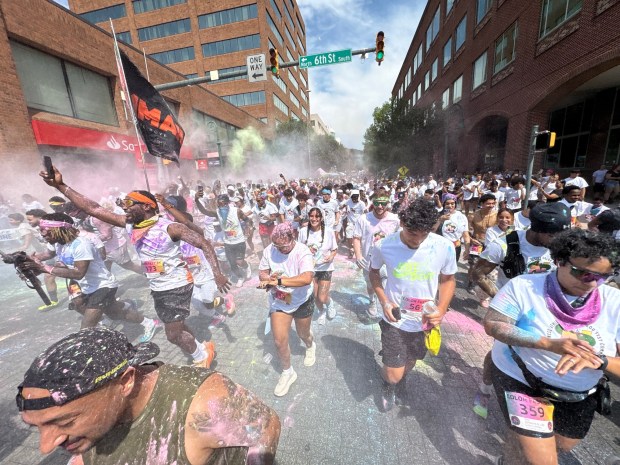 The 5K Color Run sponsored by Nemesis fitness steps off in a multi-hued cloud of dust from Sixth and Penn streets during Downtown Reading's Art and Color Fest on Saturday, Aug. 8, 2026.    (BILL UHRICH/READING EAGLE)