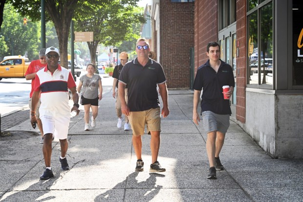The 5K Doctor Walk, led by Dr. John Irwin, right, kicks off the annual Berks Community Health Centers Community Day in the 800 block of Penn Street on Saturday, Aug. 8, 2026. (BILL UHRICH/READING EAGLE)