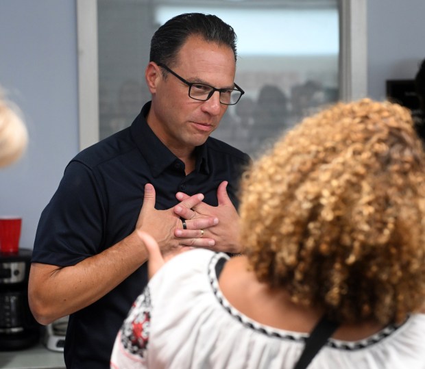 Pennsylvania Gov. Josh Shapiro reacts to a speech by state Rep. Johanny Cepeda-Freytiz during a visit Saturday to the Berks County Democrats, 1251 N. Front St. (BILL UHRICH/READING EAGLE)