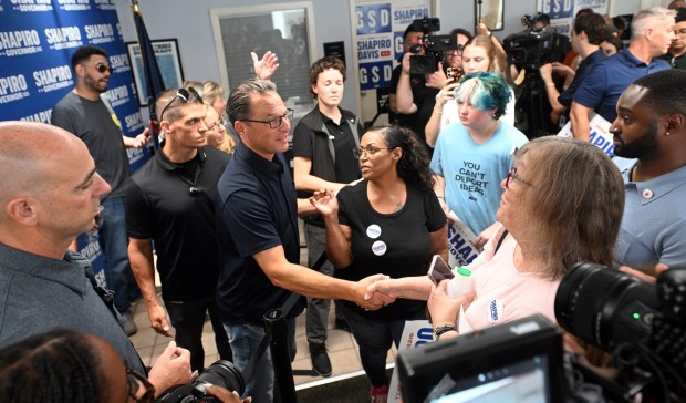 Pennsylvania Gov. Josh Shapiro greets Reading City Counci President Donna Reed during a visit Saturday to the Berks County Democrats, 1251 N. Front St. (BILL UHRICH/READING EAGLE)