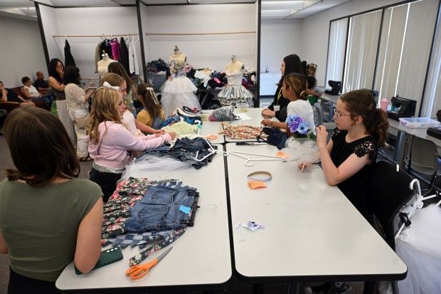 Students work on their projects during Alvernia University's Total Learning Experience Fashion and Sustainability Camp. (BILL UHRICH/READING EAGLE)