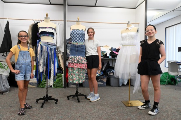 From left, Pam Iswalt, 10, a fifth grader at Gov. Mifflin Intermediate; Norah Machuzick, 11, a sixth grader at Wilson West; and Otylia Waholek, 12, a seventh grader at Conrad Weiser Middle School display their work during Alvernia University's Total Learning Experience Fashion and Sustainability Camp. (BILL UHRICH/READING EAGLE)