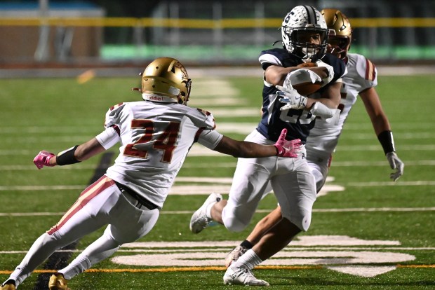 Abington Heights' Jayden Anglin evades Scranton's Ismael Salazar during the football game at Abington Heights High School in Scranton on Thursday, Oct. 16, 2025. (REBECCA PARTICKA/STAFF PHOTOGRAPHER)
