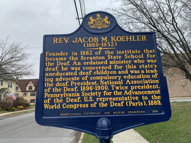An historical marker for the former Scranton State School for the Deaf, along North Washington Avenue in Green Ridge in Scranton, on April 1, 2026. (JIM LOCKWOOD / STAFF PHOTO)