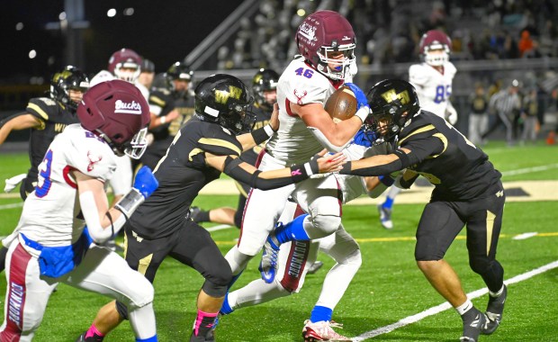 Dunmore's Xavier Burke picks up yards in the second quarter against Western Wayne on Friday, Oct. 24, 2025. (JESSE CAREY / CONTRIBUTING PHOTOGRAPHER)
