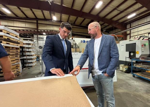 CEO of Creative Design and Machine, Inc. (CDMI) Layne Crothers, right, speaks to U.S. Rep. Rob Bresnahan during a tour at Creative Design and Machining Inc. in South Abington Twp. Monday, August 24, 2026. (SEAN MCKEAG / STAFF PHOTOGRAPHER)