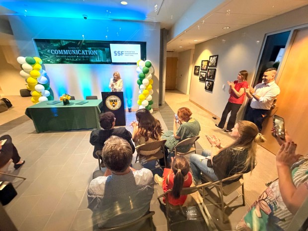 Marywood University President Lisa Lori applauds at the podium as she announces a partenership with the Scranton Shakespeare Festival in the Marywood University School of Communication in Dunmore Monday, August 24, 2026. (SEAN MCKEAG / STAFF PHOTOGRAPHER)