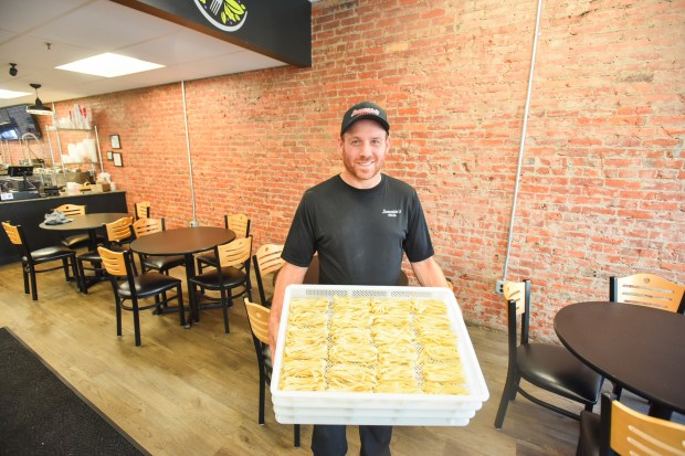 Pasta on Penn co-owner Sammy Parlopiano III shows off some pasta in his business in downtown Scranton Thursday, August 6, 2026. (SEAN MCKEAG / STAFF PHOTOGRAPHER)