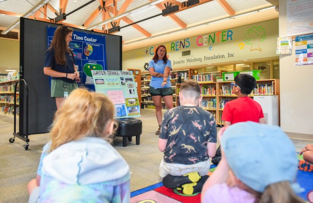 Engineers with Pennsylvnia American Water Melanie Fouts and Sarah Mihalick give a presentation on water tanks to students during the Wonderful World of Water Camp at Valley Community Library in Peckville Monday, August 3, 2026. (SEAN MCKEAG / STAFF PHOTOGRAPHER)