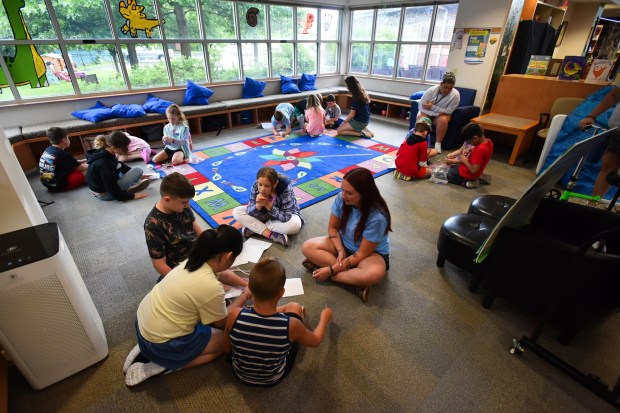Students form groups to work on an activity during the Wonderful World of Water Camp at Valley Community Library in Peckville Monday, August 3, 2026. (SEAN MCKEAG / STAFF PHOTOGRAPHER)