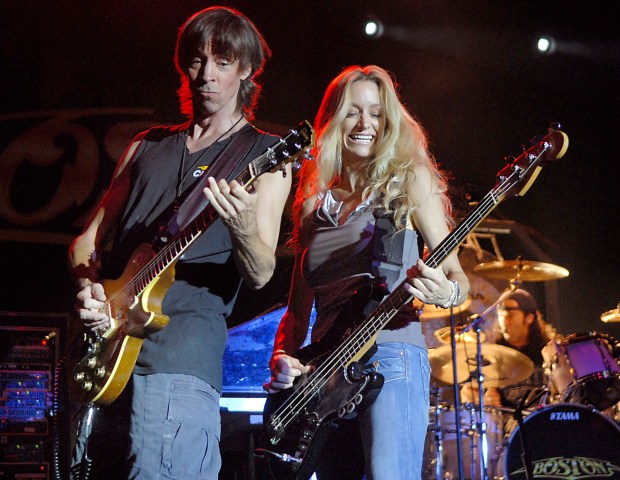 BETHLEHEM - - 5MUSIKFESTboston-- Founding member Tom Scholz joins bassist Kimberly Dahme with classic rock band Boston on stage at Riverplace during headliner show at Musikfest on Monday, August 4, 2008. (Harry Fisher/TMC) |// to be published with GEHMAN story in LOCAL. ORG XMIT: NGM_0K53TB7R***** Headline: Boston to bring '70s hits to Musikfest ** The band will play at the Steel Stage main venue on the festival's final night. (2/18/12) *****