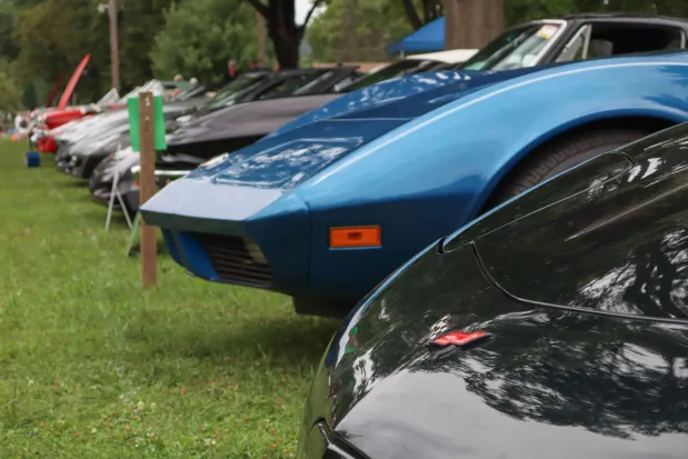 A row of Chevrolet Corvettes are parked for display Sunday, Aug. 2, 2026, at the 63rd annual Das Awkscht Fescht antique and classic car show at Macungie Memorial Park in Macungie. (Jon Chiu/The Morning Call)