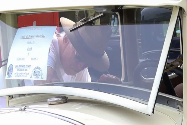Andy Harakal of Coplay inspects his 1930 Ford Model A on Sunday, Aug. 2, 2026, at the 63rd annual Das Awkscht Fescht antique and classic car show at Macungie Memorial Park in Macungie. (Jon Chiu/The Morning Call)