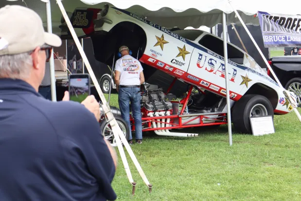 Bruce Larson demonstrates the power of the engine of his USA-1 Chevrolet Camaro on Sunday, Aug. 2, 2026, at the 63rd annual Das Awkscht Fescht antique and classic car show at Macungie Memorial Park in Macungie. (Jon Chiu/The Morning Call)