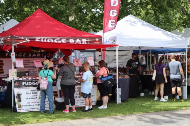 People interact with vendors Sunday, Aug. 2, 2026, at the 63rd annual Das Awkscht Fescht antique and classic car show at Macungie Memorial Park in Macungie. (Jon Chiu/The Morning Call)