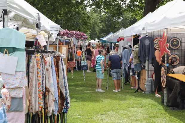 People interact with vendors Sunday, Aug. 2, 2026, at the 63rd annual Das Awkscht Fescht antique and classic car show at Macungie Memorial Park in Macungie. (Jon Chiu/The Morning Call)