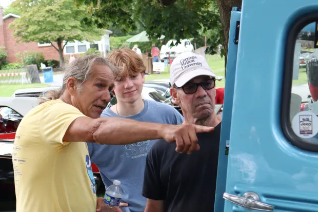 David Kline of Quakertown shows people the interior of his 1964 Willys Wagon on Sunday, Aug. 2, 2026, at the 63rd annual Das Awkscht Fescht antique and classic car show at Macungie Memorial Park in Macungie. (Jon Chiu/The Morning Call)