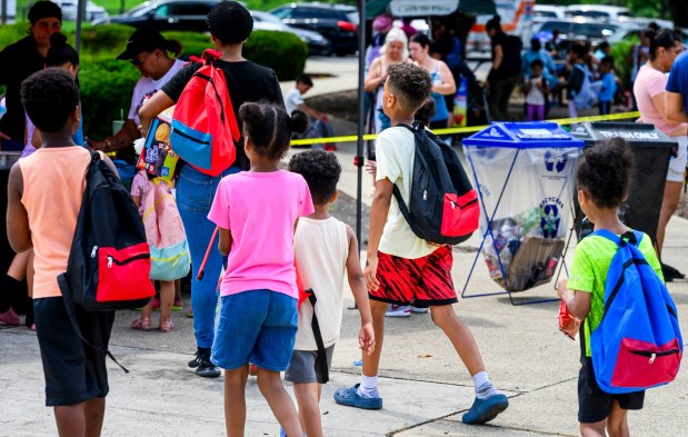 Children chose free backpacks Saturday, Aug. 8, 2026, during the 9th Annual Back To School Event hosted by Puertorrican Culture Preservation Inc at Buck Boyle Park in Allentown. The event featured 500 free backpacks, snacks and back-to-school supplies given by local organizations. (April Gamiz/The Morning Call)