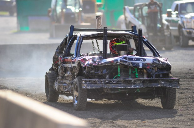 Cars crash and kick up mud Monday, Sept. 1, 2025 during the Annual J&J Demolition Derby at the Great Allentown Fair. The Derby is a Labor Day tradition on the final night of the fair. (Jonathan Broady/Special to The Morning Call)