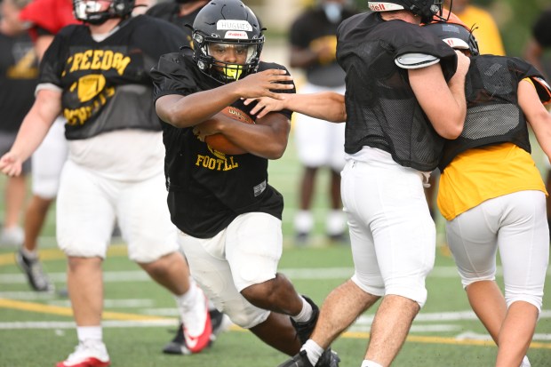 Freedom High School Football players run drills Monday, Aug. 17, 2026, during their football practice in Bethlehem. Freedom is coming off a tough season by their standards. The Patriots were 5-6 last season, but are optimistic about staging a turnaround. (Monica Cabrera/The Morning Call)