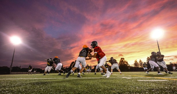 Freedom High School Football players run drills in the evening of Monday, Aug. 17, 2026, during their football practice in Bethlehem. Freedom is coming off a tough season by their standards. The Patriots were 5-6 last season, but are optimistic about staging a turnaround. (Monica Cabrera/The Morning Call)