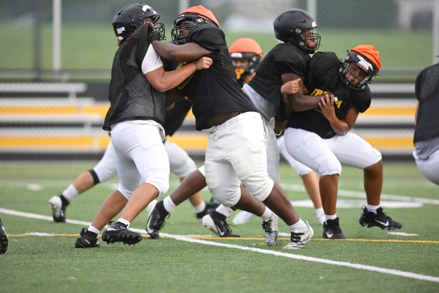 Freedom High School Football players run drills Monday, Aug. 17, 2026, during their football practice in Bethlehem. Freedom is coming off a tough season by their standards. The Patriots were 5-6 last season, but are optimistic about staging a turnaround. (Monica Cabrera/The Morning Call)