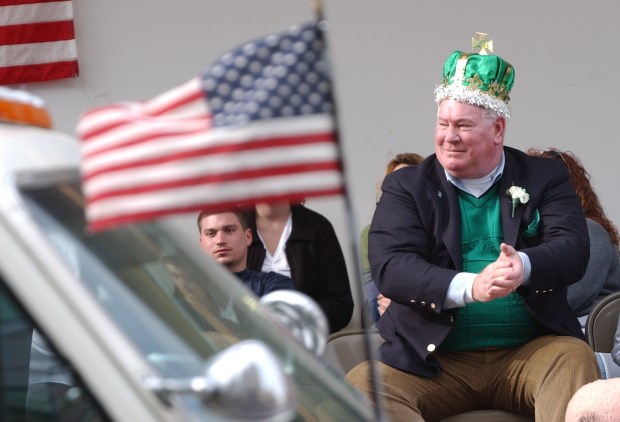 Allentown St. Patrick's Day parade grand marshal Lehigh County District Attorney Jim Martin claps as paraders pass the reviewing stand Sunday, March 16, 2003. (Cesar L. Laure/The Morning Call)