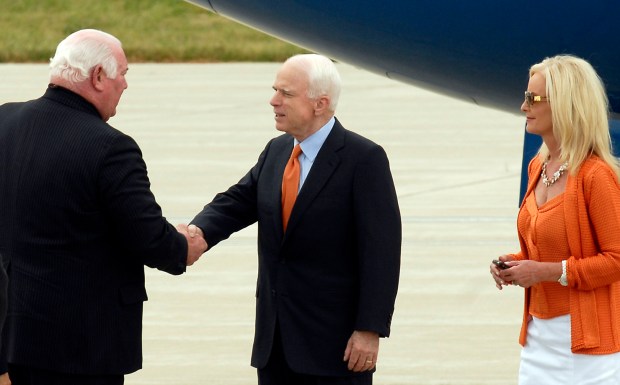 Republican presidential candidate Sen. John McCain, center, shakes the hand of Lehigh County District Attorney Jim Martin after exiting his new Straight Talk Express Boeing 737-400 at Lehigh Valley International Airport, Hanger 7, Allentown, Monday afternoon, June 30, 2008, en route to an appearance in Pipersville, Pa. On the far right is Cindy McCain. (Kathleen X. Cook /The Morning Call)
