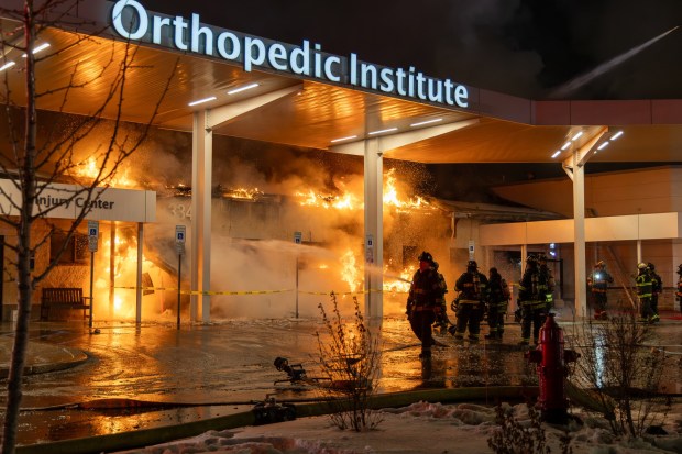 Crews rush to a fire at Lehigh Valley Hospital - Dickson City at about 9:30 p.m. on Wednesday, Feb. 5, 2026. Authorities on Thursday morning continued to investigate the fire at Lehigh Valley Hospital-Dickson City that sent flames shooting from the roof and required the evacuation of 77 patients relocated to other area hospitals. (COLIN GILDEA/NEPA Fire Photography/Special to The Morning Call)