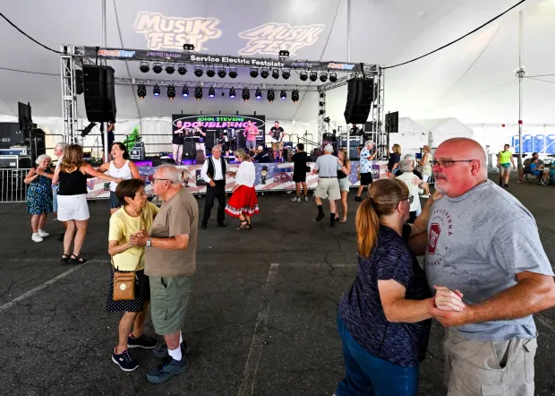 People dance Sunday, Aug. 9, 2026, as John Stevens' Doubleshot Polka Band plays at Service Electric Festplatz on the last day of Musikfest in Bethlehem. (April Gamiz/The Morning Call)