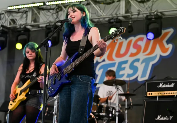 Riviera Heubach, left and Isabella Tierney sing and play guitar and bass Sunday, Aug. 9, 2026, the last day of Musikfest, as part of the Lesson Center's Fest Camp summer band program at Plaza Tropical in Bethlehem. (April Gamiz/The Morning Call)