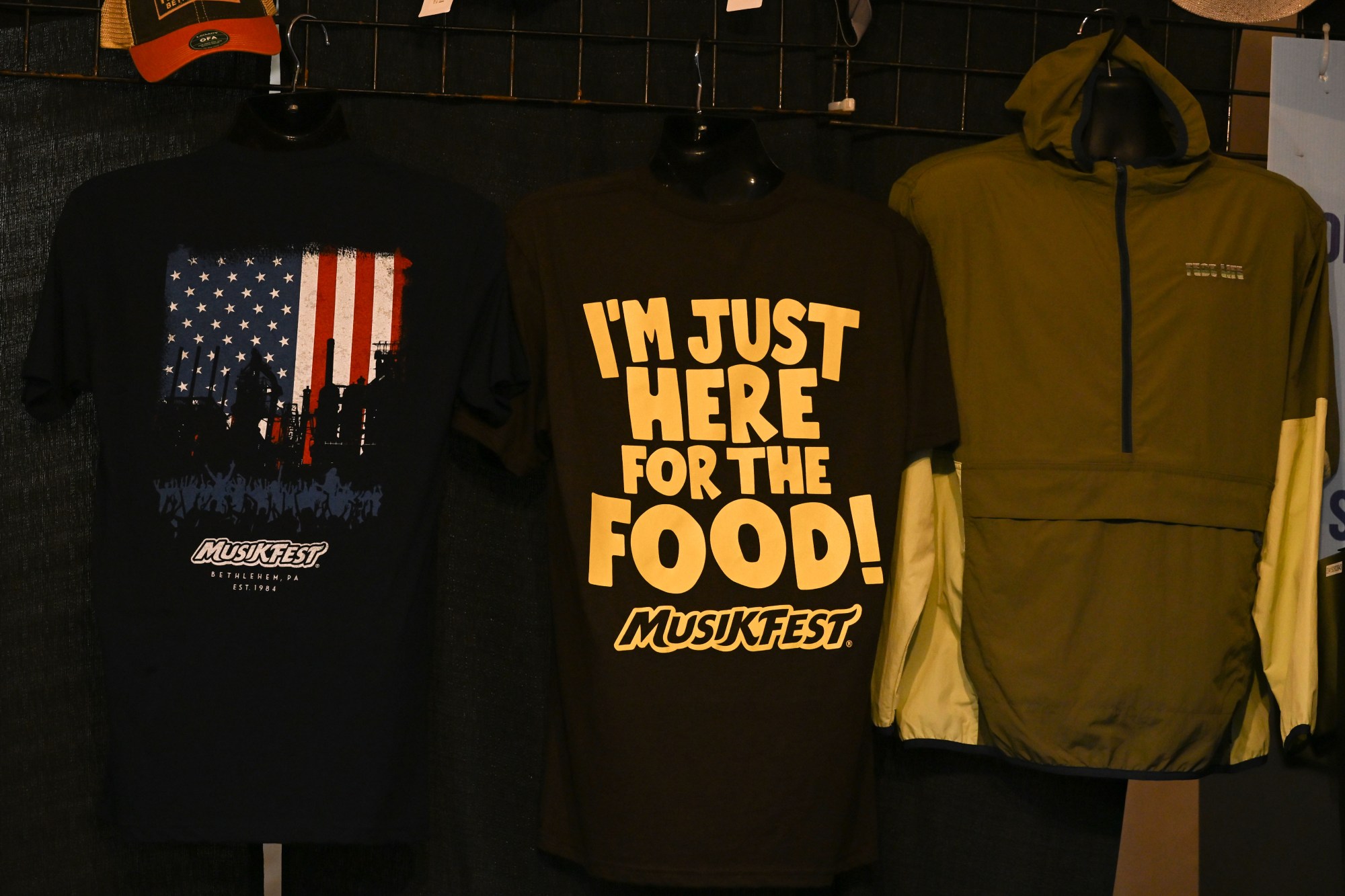 Merchandise hangs on display during Musikfest on Friday, Aug. 7, 2026, at the SteelStacks in Bethlehem. (Jon Chiu/The Morning Call)